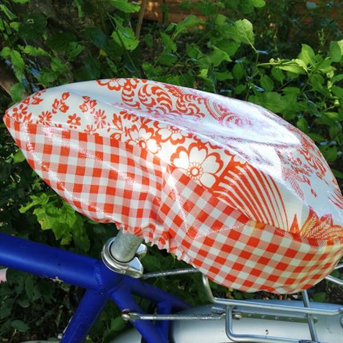 Cykelsadelovertræk Margit Orange Mix holder regnen ude fra din cykel